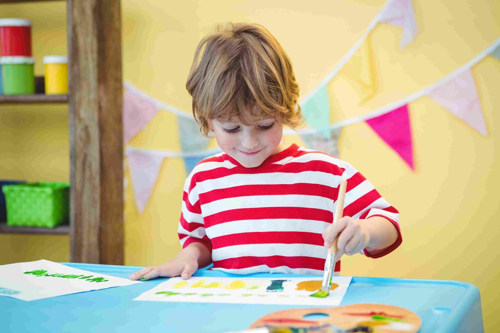 child-painting-a-beautiful-picture-at-the-desk-2025-04-03-11-59-57-utc_11zon